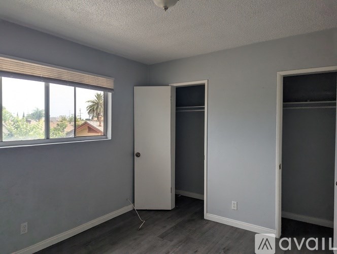 A room with a door, a window, and a wall.