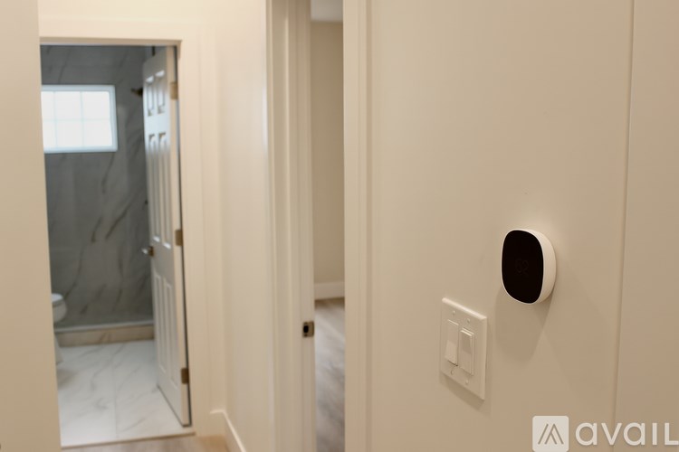 A white door with a round hole in the middle of it.