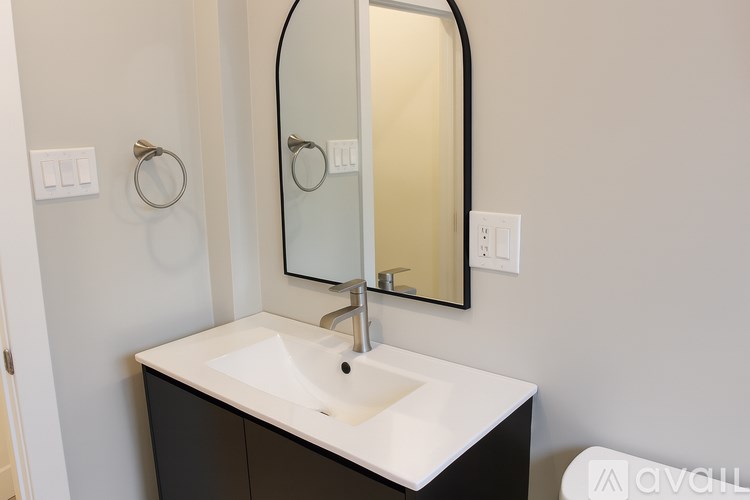 A bathroom sink with a mirror above it.