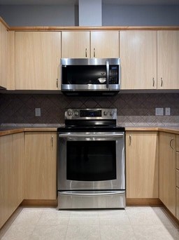 A modern kitchen with a stove and oven.
