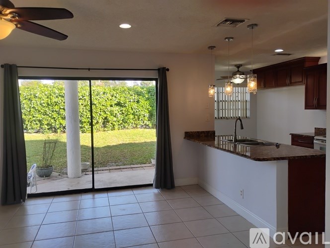 A sign that says Deer Pointe in front of a car.