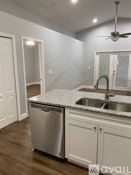 A kitchen with a dishwasher and a sink.
