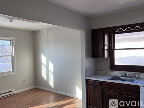 A kitchen area with a window and a sink.