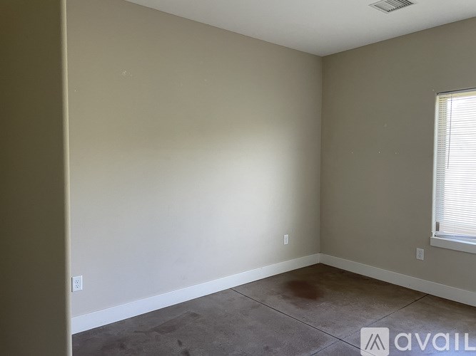 Empty room with a window on the right side.