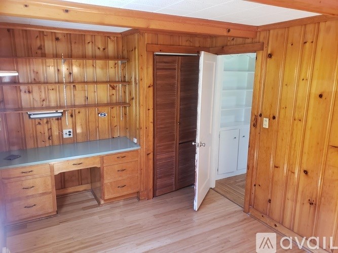 A wooden desk with drawers and a computer desk with a drawer and a shelf.