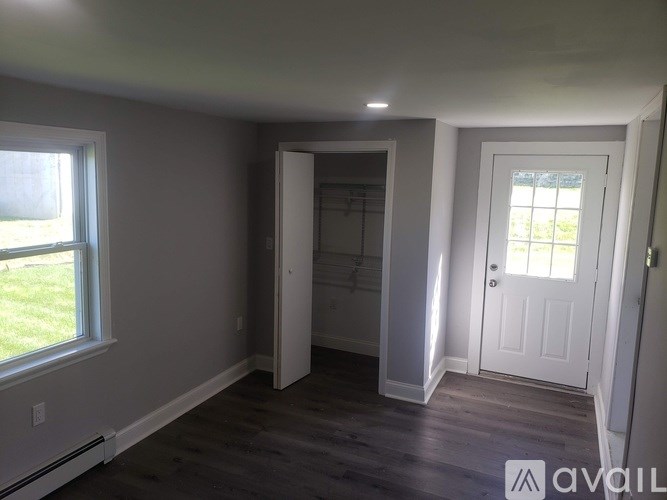 A room with a door and a window.