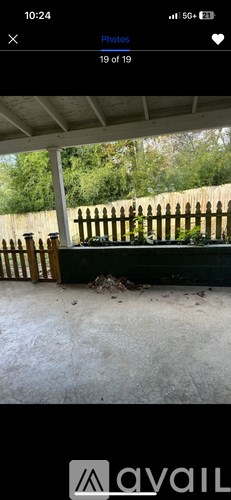 A photo of a wooden fence and a shed.