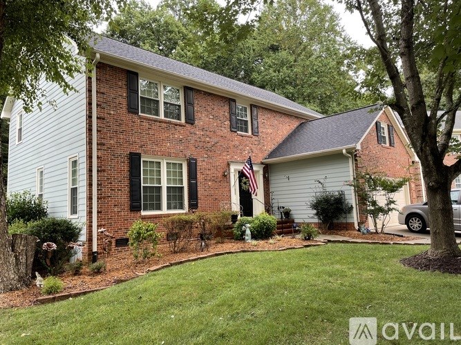 A house with a flag on the front porch.