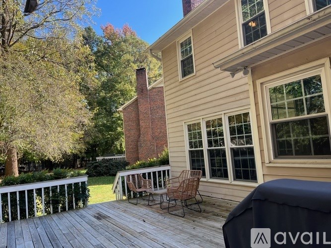 A house with a deck and patio furniture.