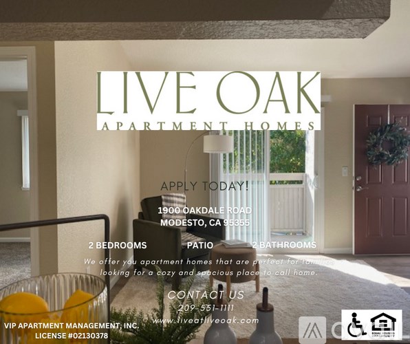 A sign for Live Oak Apartment Homes with a glass of orange juice on a table.