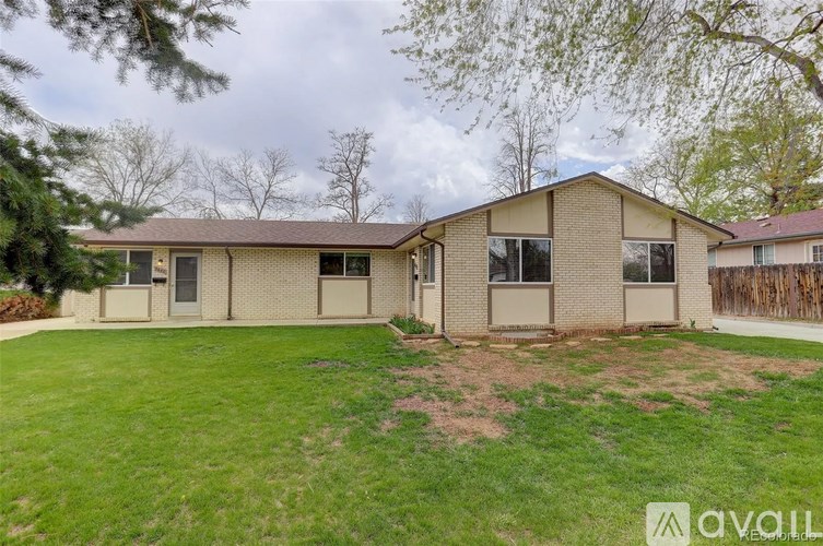 A house with a lawn in front of it is for sale.
