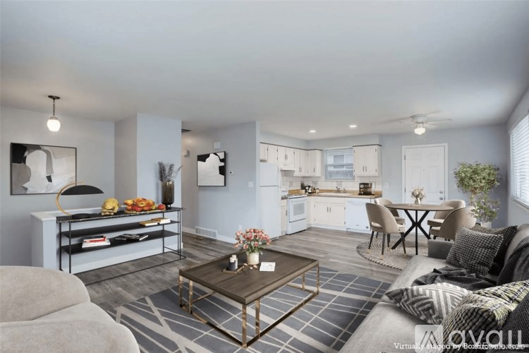 A modern living room with a grey sofa and a coffee table.