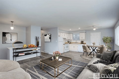 A modern living room with a grey sofa and a coffee table.