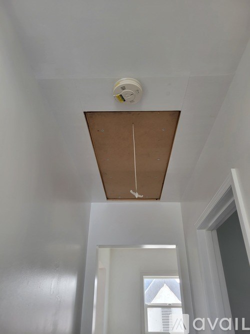 A smoke detector is mounted on the ceiling.