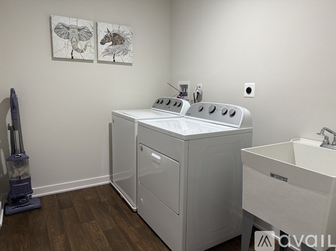 A white washer and dryer in a laundry room.