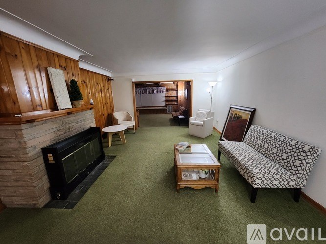A living room with a fireplace and a couch.