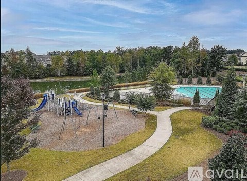 A playground with a slide and a roundabout.