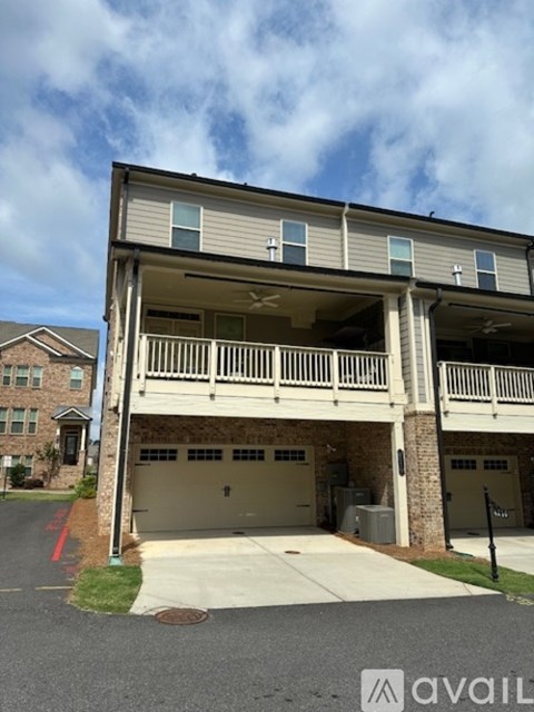 A two-story building with a garage on the lower level.
