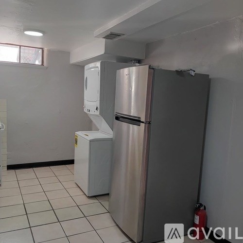 A stainless steel refrigerator and freezer in a kitchen.