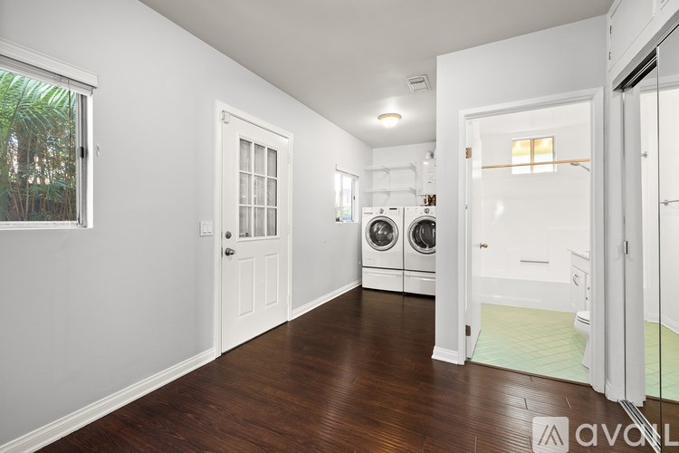 A laundry room with a washer and dryer.