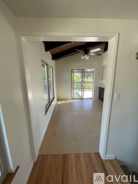 A long hallway with a door at the end.