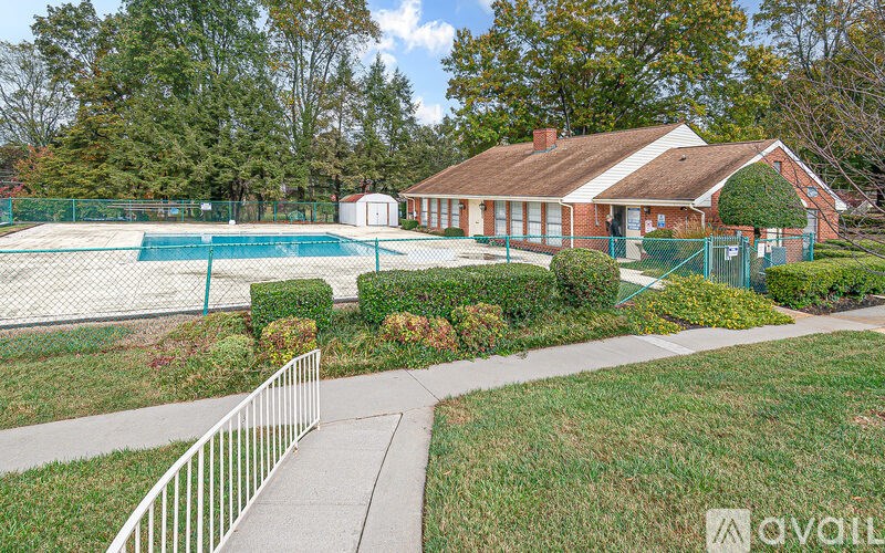 A house with a pool in the backyard.