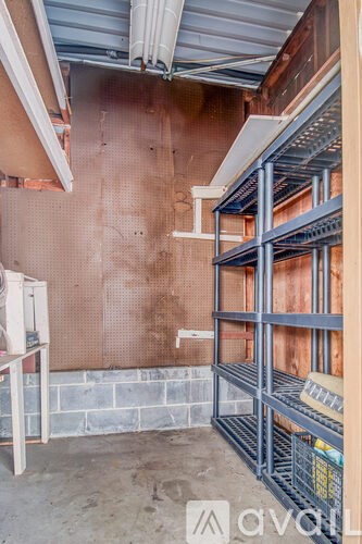 A construction site with exposed pipes and unfinished walls.