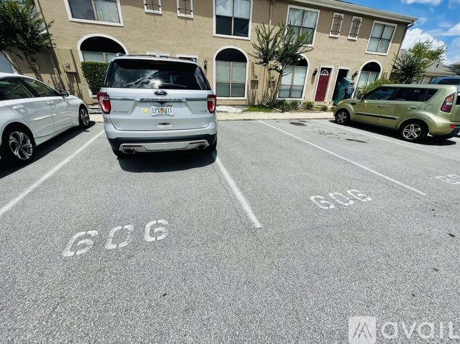 A parking lot with the number 606 painted on the pavement.