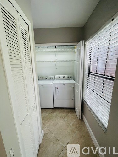 A laundry room with a washer and dryer.