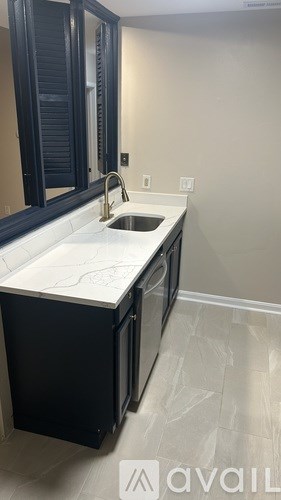 A bathroom with a sink and a mirror.