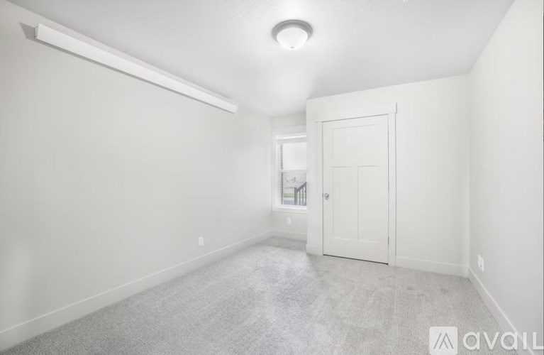 A room with a door and a window.