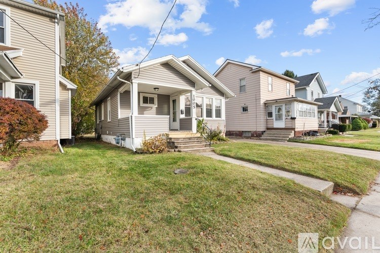A house with a lawn in front of it is for sale.