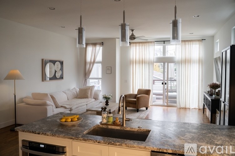 A kitchen with granite countertops and a modern design.