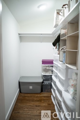 A storage room with a lot of boxes and containers.