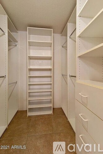 A white pantry with a pull-out drawer in the middle.