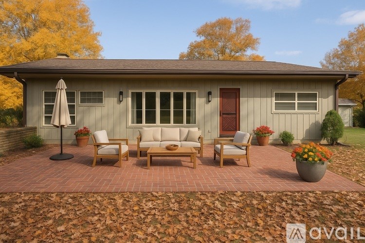 A house with a patio and furniture set.