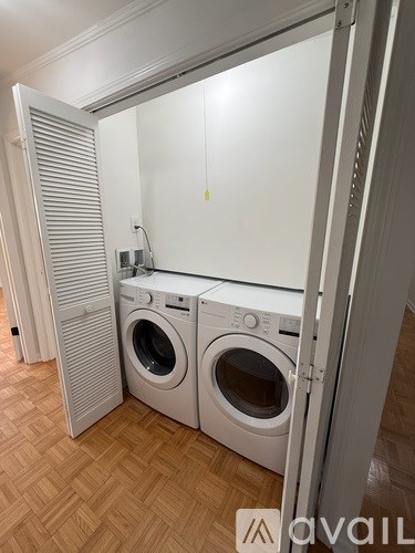 A laundry room with a washer and dryer.