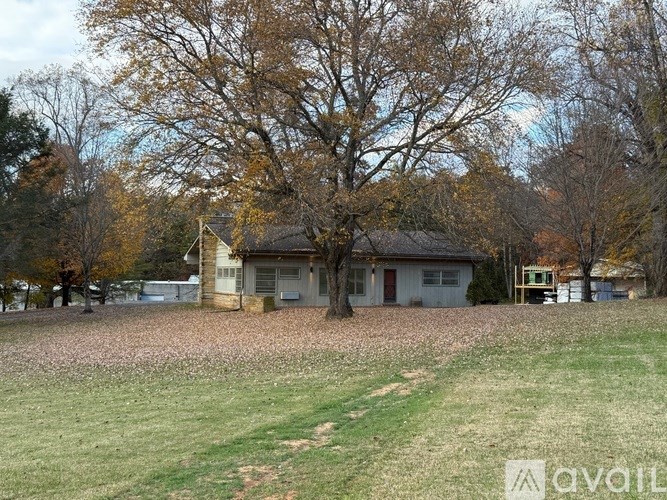 A house with a tree in front of it.