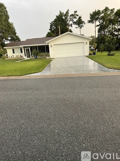 A house with a driveway in front of it.