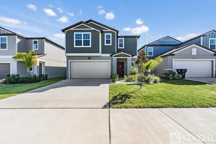 A row of houses with a clear blue sky above them.