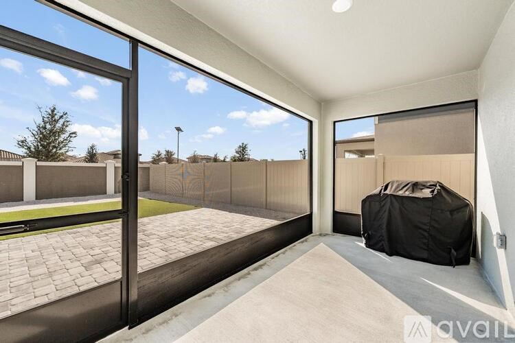 A patio area with a black tarp on the right side.