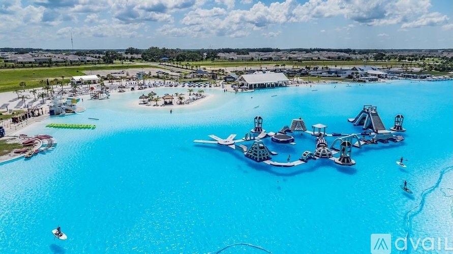 A large body of water with boats and a pier.