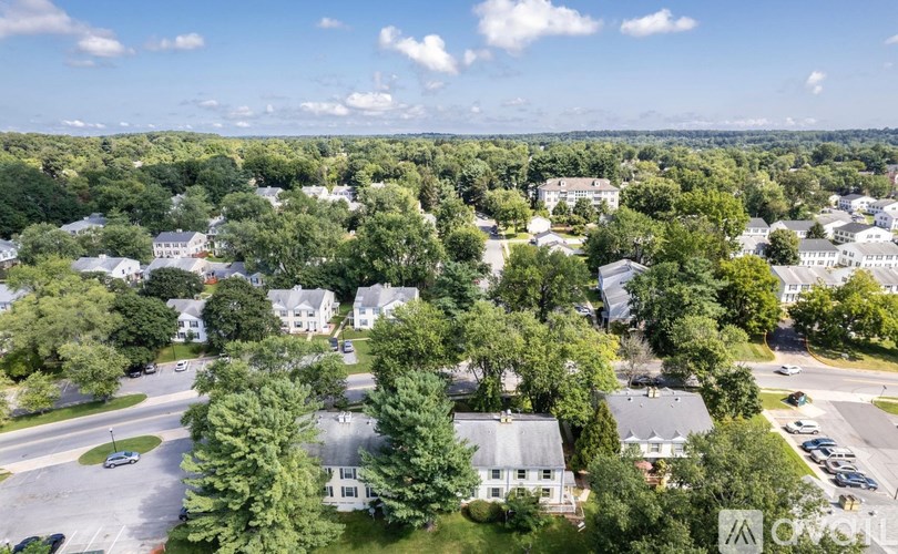 A bird's eye view of a residential area with houses and trees.