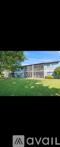 A modern house with a large front yard.
