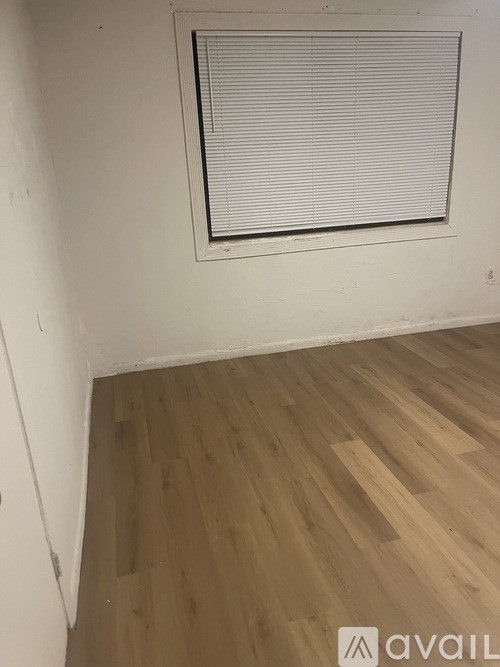 A smoke detector is mounted on a wall.