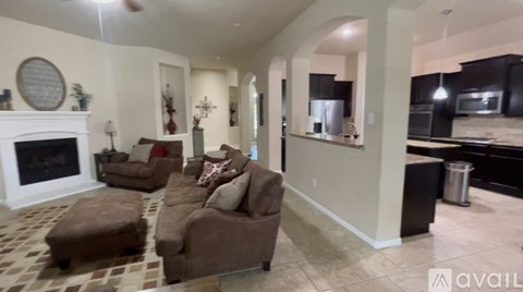 A living room with a fireplace and a couch.