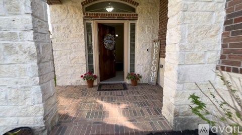 A welcoming entrance with a wooden door and a sign that says "Welcome".