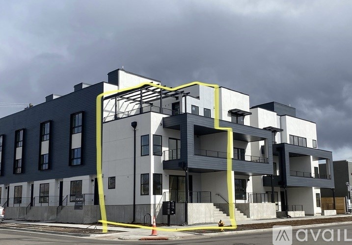 A modern building with a yellow and black staircase.