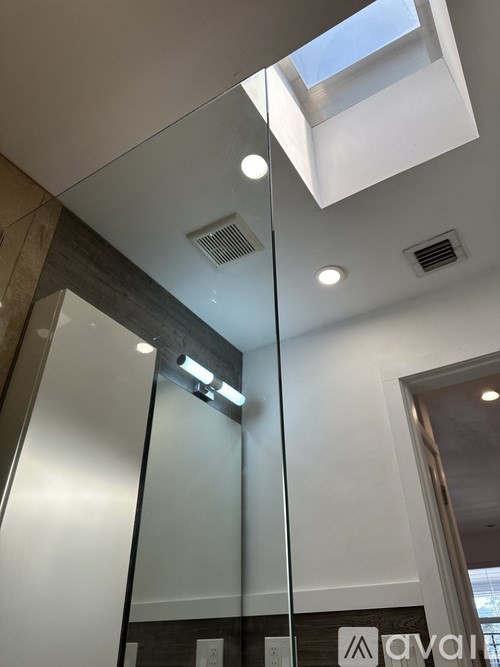 A glass wall with Avani logo on it.