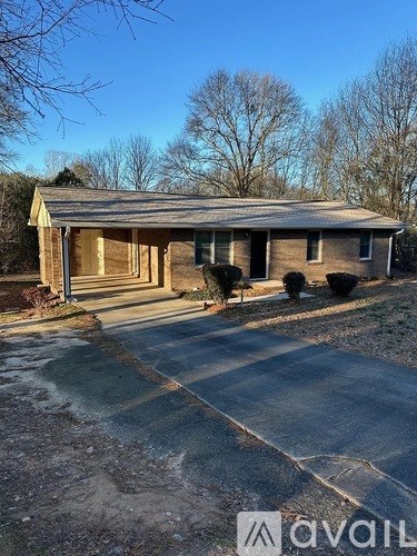 A house with a driveway in front of it.